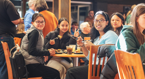 International Students Pose in Dining Hall